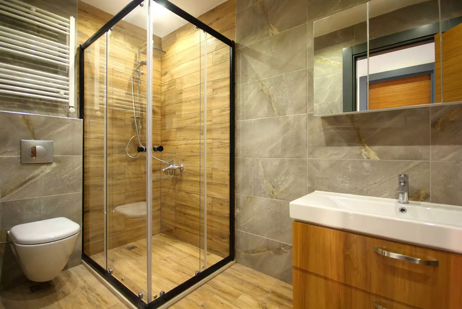 Glass shower enclosure in modern bathroom