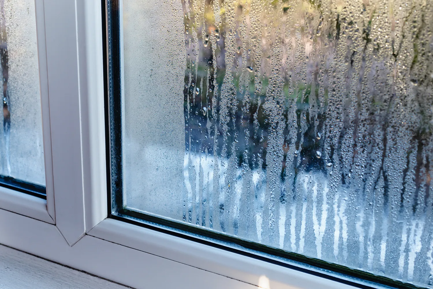 Condensation and water droplets on a double-glazed window
