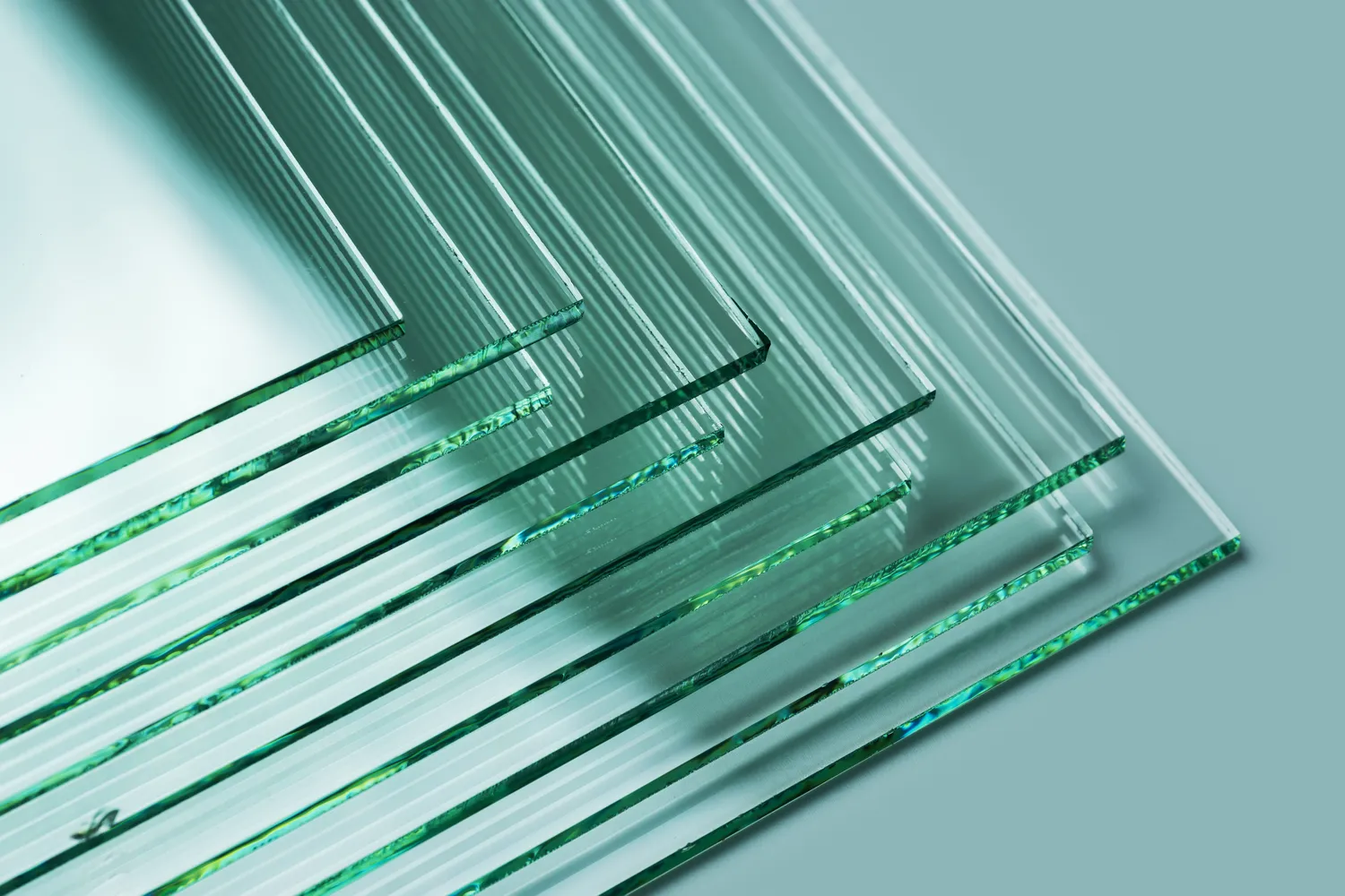 Sheets of Factory manufacturing tempered clear float glass panels cut to size.